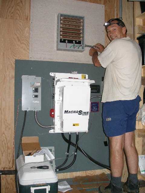 Electrican wiring the diversion load for the hydr turbine.